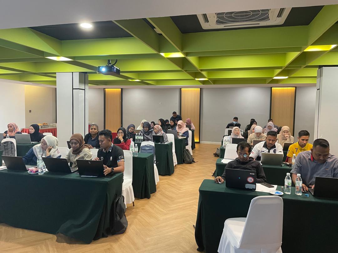 An instructor leading a upskilling class on a laptop